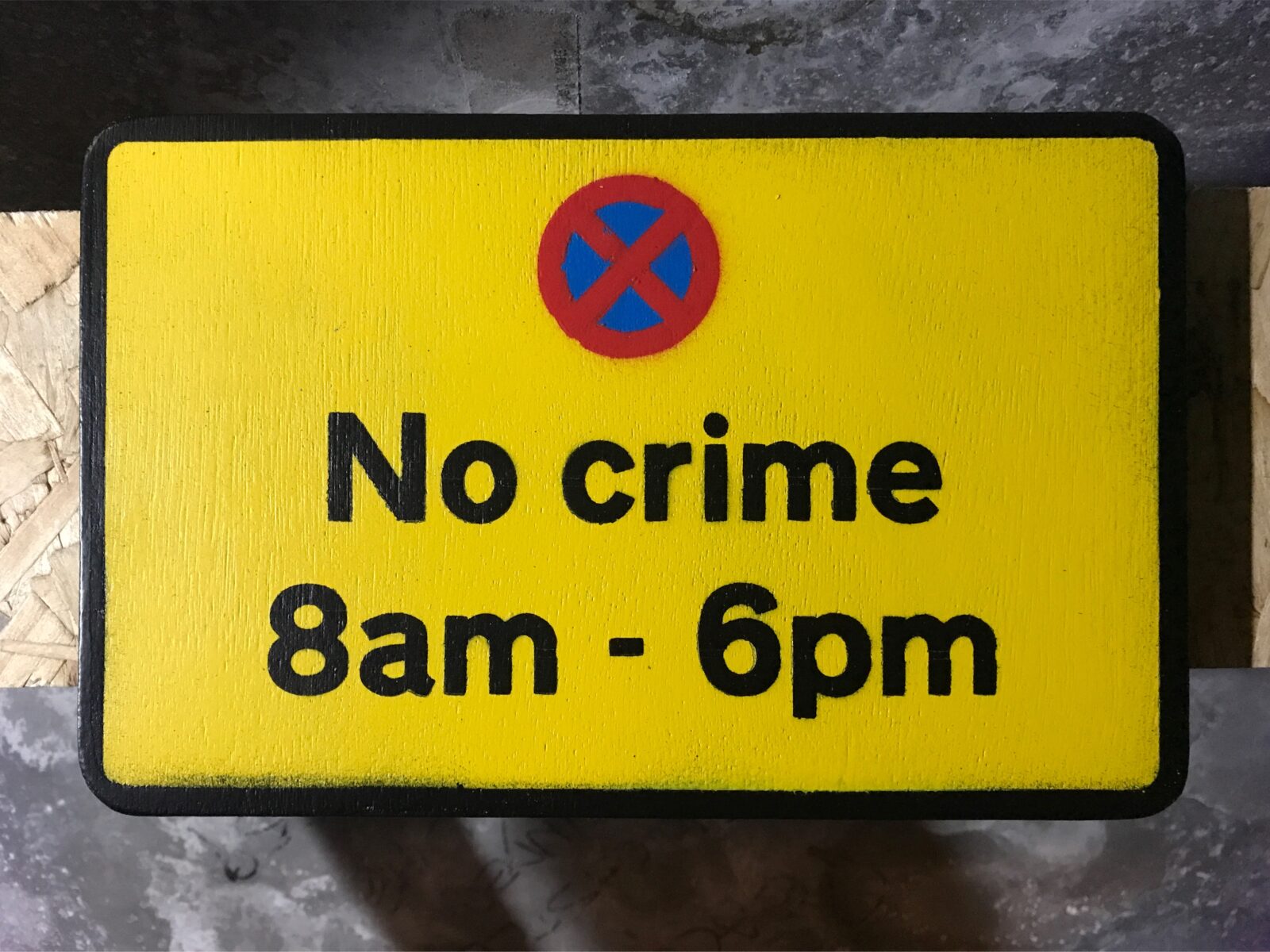 "No Crime 8am - 6pm" hand painted wooden road sign by Chu